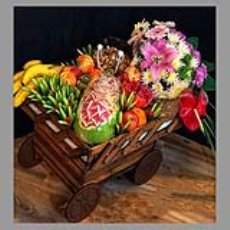 چرخ با تزئین میوه و گل یلدا